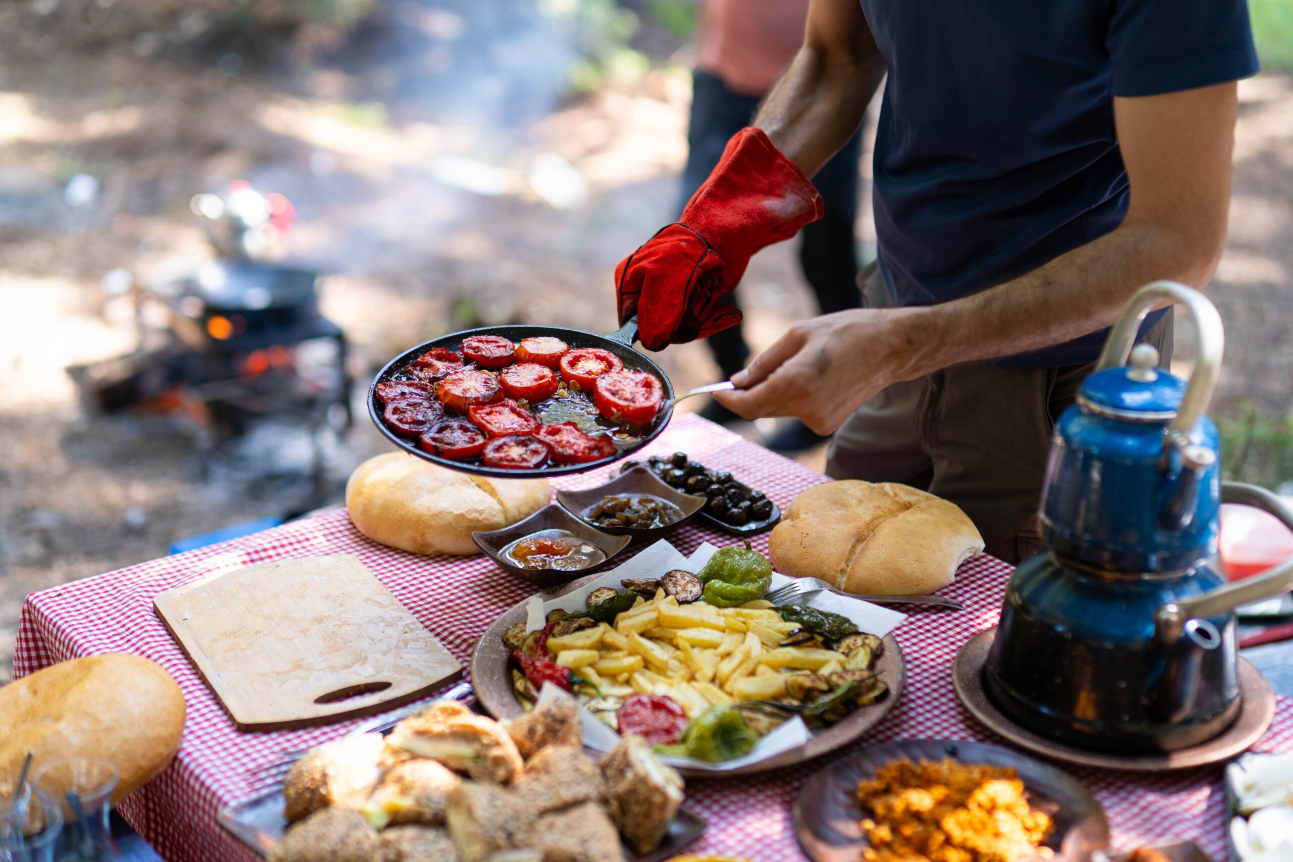 Easy Camping Meals A man frying pan with Tometos